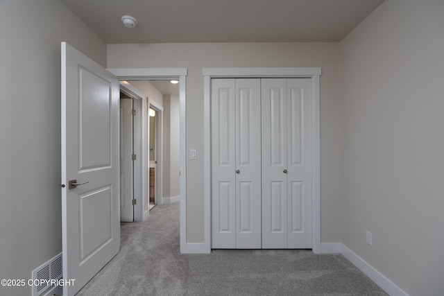 3680 Little Bear Pl Unit 8, Anchorage, AK 99504 - unfurnished bedroom featuring carpet flooring and a closet