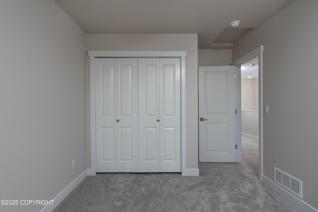 3680 Little Bear Pl Unit 8, Anchorage, AK 99504 - unfurnished bedroom featuring carpet and a closet