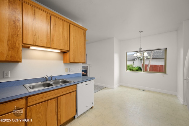 230 W Fallen Leaf Cir, Wasilla, AK 99654 - kitchen with dishwasher, a chandelier, pendant lighting, and brown cabinetry