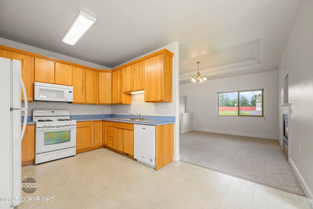230 W Fallen Leaf Cir, Wasilla, AK 99654 - kitchen featuring white appliances, open floor plan, a chandelier, light carpet, and a glass covered fireplace