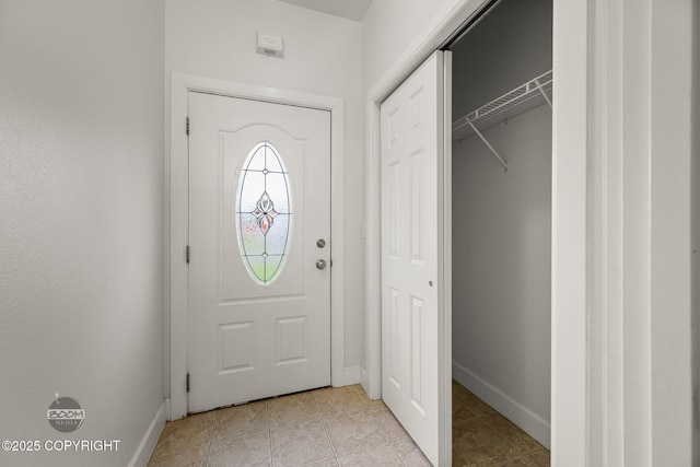 230 W Fallen Leaf Cir, Wasilla, AK 99654 - entryway featuring baseboards and light tile patterned flooring