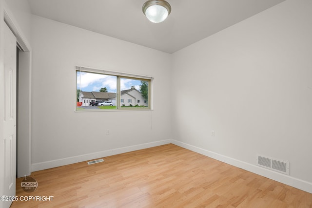 230 W Fallen Leaf Cir, Wasilla, AK 99654 - unfurnished bedroom with light wood-style floors and a closet