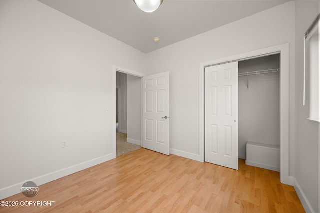230 W Fallen Leaf Cir, Wasilla, AK 99654 - unfurnished bedroom with wood finished floors and a closet