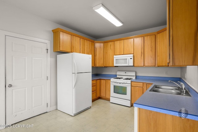 230 W Fallen Leaf Cir, Wasilla, AK 99654 - kitchen with white appliances, light flooring, and brown cabinetry