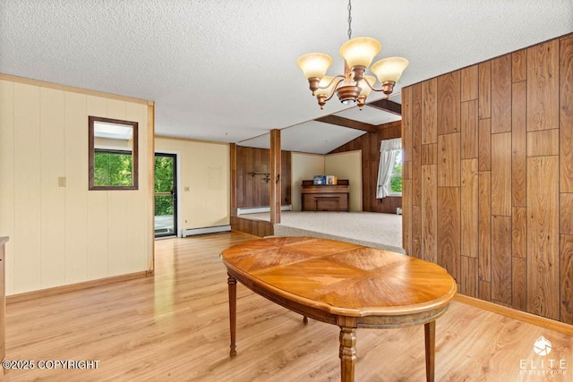 13440 Diggins Dr, Anchorage, AK 99515 - dining space with light wood finished floors, a baseboard heating unit, a chandelier, plenty of natural light, and wood walls