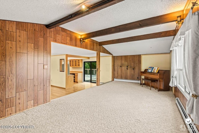 13440 Diggins Dr, Anchorage, AK 99515 - living area with baseboard heating, wood walls, a textured ceiling, and light carpet
