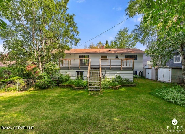 13440 Diggins Dr, Anchorage, AK 99515 - rear view of property featuring stairway, a storage shed, and a wooden deck