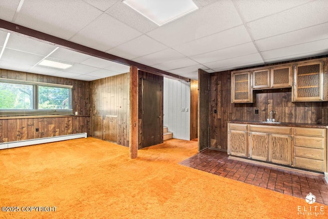 13440 Diggins Dr, Anchorage, AK 99515 - bar area featuring wooden walls, a paneled ceiling, a baseboard heating unit, and dark carpet