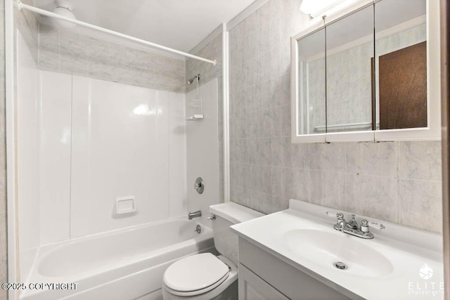 13440 Diggins Dr, Anchorage, AK 99515 - full bathroom with vanity, tile walls, and washtub / shower combination