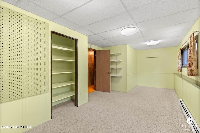 13440 Diggins Dr, Anchorage, AK 99515 - hallway featuring a baseboard radiator, a drop ceiling, and carpet