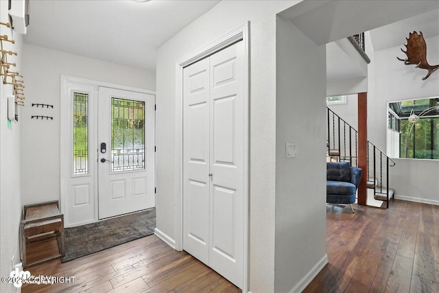 1535 M St, Anchorage, AK 99501 - foyer entrance with wood-type flooring, healthy amount of natural light, and stairs