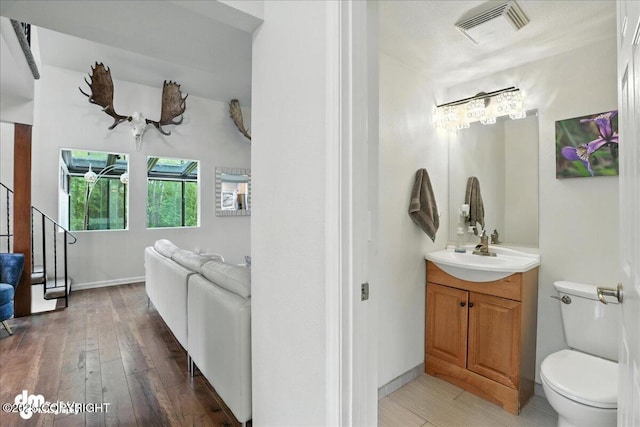 1535 M St, Anchorage, AK 99501 - bathroom featuring vanity and wood-type flooring