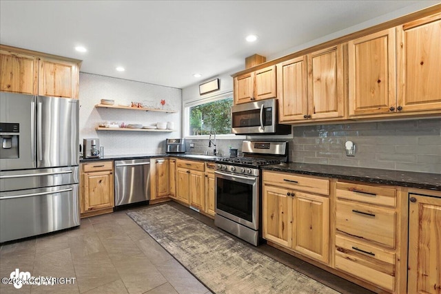 1535 M St, Anchorage, AK 99501 - kitchen with appliances with stainless steel finishes, backsplash, open shelves, recessed lighting, and dark stone countertops