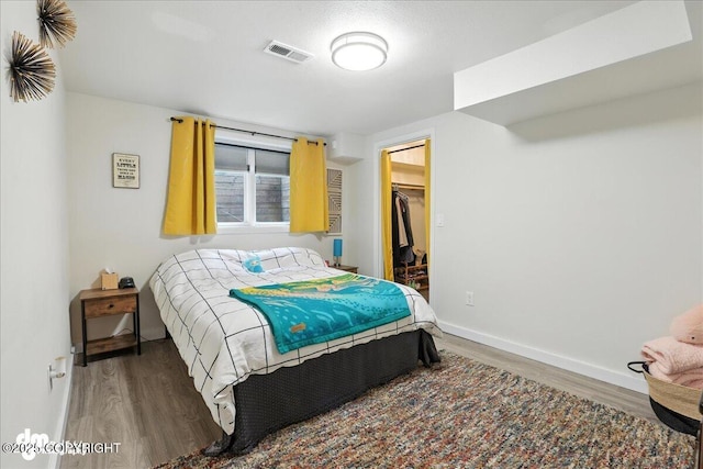 1535 M St, Anchorage, AK 99501 - bedroom with wood finished floors and a spacious closet
