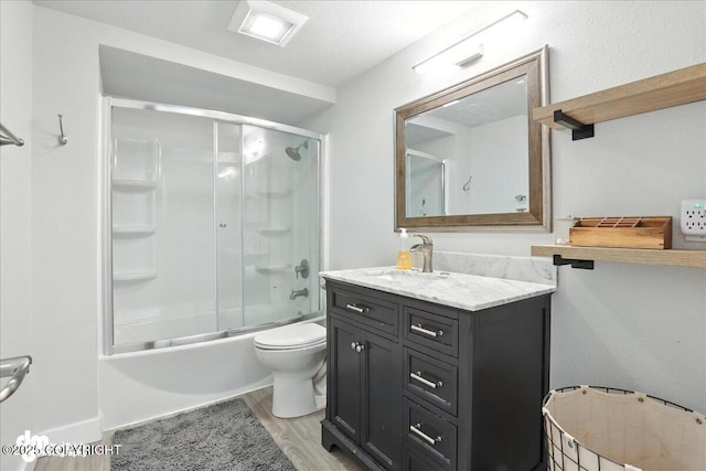 1535 M St, Anchorage, AK 99501 - full bath featuring vanity, shower / bath combination with glass door, and wood finished floors