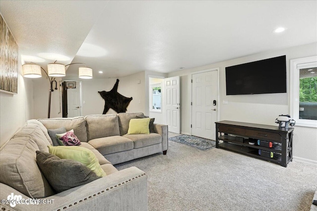 1535 M St, Anchorage, AK 99501 - carpeted living room featuring baseboards and recessed lighting