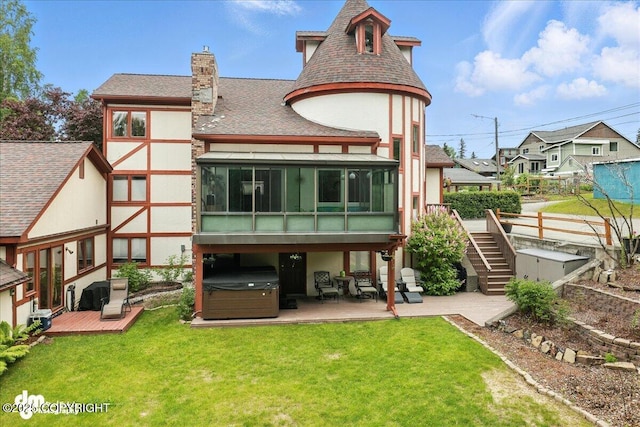 1535 M St, Anchorage, AK 99501 - rear view of house with a hot tub, stucco siding, a sunroom, a deck, and a chimney