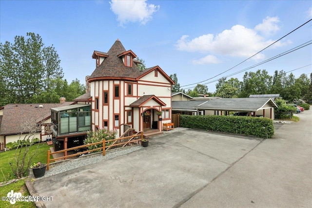 1535 M St, Anchorage, AK 99501 - english style home featuring stucco siding and a sunroom