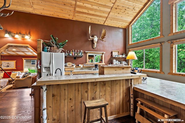 29416 W Deshka Landing Rd, Willow, AK 99688 - kitchen with white fridge with ice dispenser, dark wood-type flooring, wood ceiling, and high vaulted ceiling