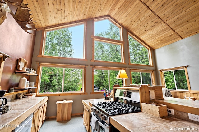 29416 W Deshka Landing Rd, Willow, AK 99688 - kitchen featuring gas range, tile countertops, wood ceiling, high vaulted ceiling, and plenty of natural light