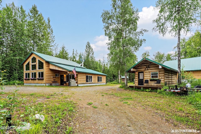 29416 W Deshka Landing Rd, Willow, AK 99688 - back of house featuring a metal roof, driveway, and a wooden deck