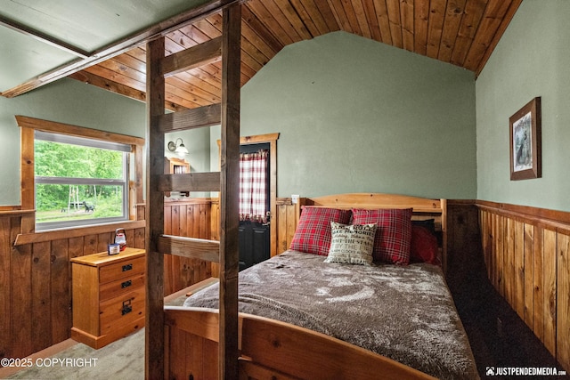 29416 W Deshka Landing Rd, Willow, AK 99688 - bedroom featuring carpet flooring, lofted ceiling, wainscoting, wooden walls, and wooden ceiling