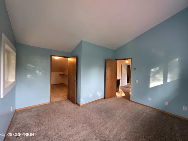 297 Mitkof Hwy, Petersburg, AK 99833 - unfurnished bedroom with vaulted ceiling and carpet flooring