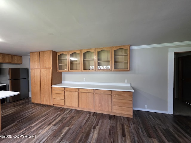 297 Mitkof Hwy, Petersburg, AK 99833 - kitchen featuring freestanding refrigerator, dark wood-style floors, glass insert cabinets, and light countertops