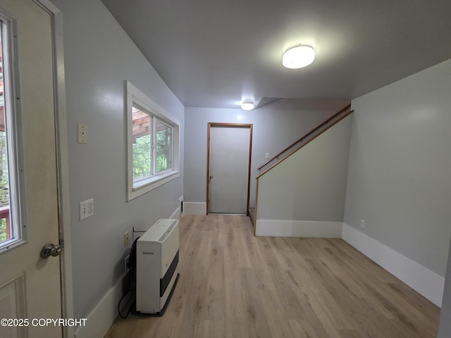 297 Mitkof Hwy, Petersburg, AK 99833 - foyer featuring light wood-style flooring, plenty of natural light, stairway, and heating unit