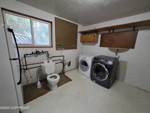 297 Mitkof Hwy, Petersburg, AK 99833 - laundry area featuring washer and clothes dryer and tile patterned floors