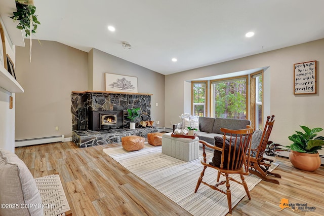 22479 Centurion Dr, Chugiak, AK 99567 - living room featuring a baseboard heating unit, wood finished floors, lofted ceiling, and recessed lighting