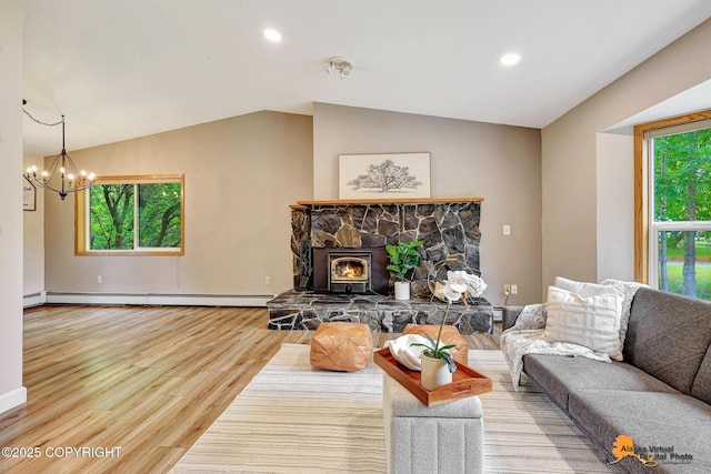 22479 Centurion Dr, Chugiak, AK 99567 - living room with a chandelier, wood finished floors, recessed lighting, vaulted ceiling, and a baseboard heating unit