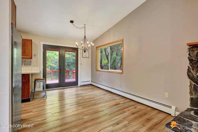 22479 Centurion Dr, Chugiak, AK 99567 - unfurnished dining area with a baseboard radiator, french doors, light wood finished floors, plenty of natural light, and vaulted ceiling