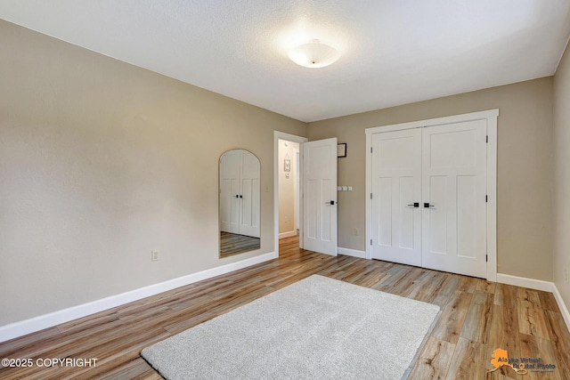 22479 Centurion Dr, Chugiak, AK 99567 - unfurnished bedroom featuring wood finished floors and a closet