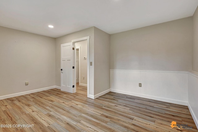 22479 Centurion Dr, Chugiak, AK 99567 - spare room with light wood-type flooring, a wainscoted wall, and recessed lighting