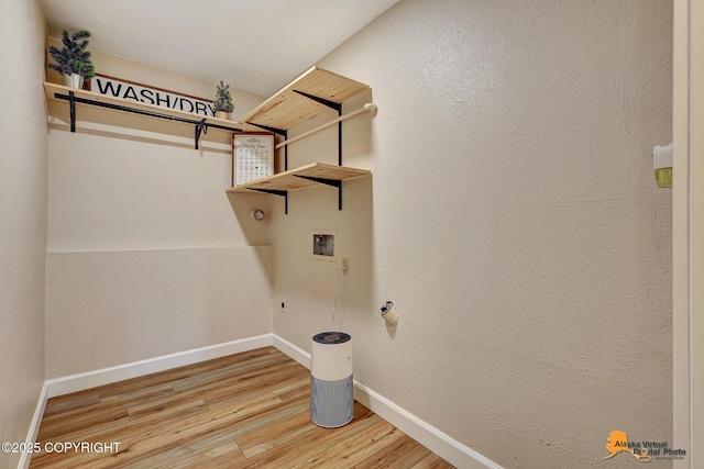 22479 Centurion Dr, Chugiak, AK 99567 - laundry area with hookup for a washing machine, wood finished floors, and electric dryer hookup