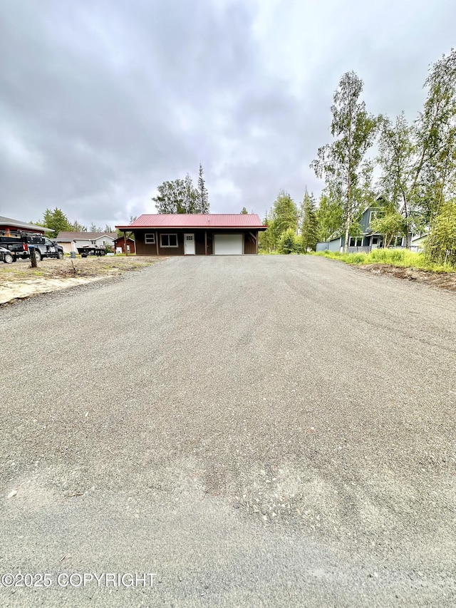 35870 Glory St, Soldotna, AK 99669 - ranch-style home featuring an attached garage, driveway, and a metal roof