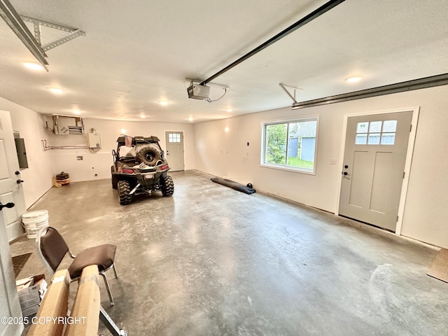 35870 Glory St, Soldotna, AK 99669 - garage featuring a garage door opener and electric panel