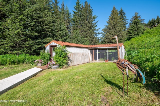 2500 W Highland Dr, Homer, AK 99603 - view of green lawn with a sunroom