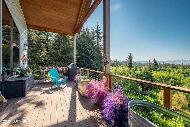 2500 W Highland Dr, Homer, AK 99603 - wooden terrace featuring a forest view