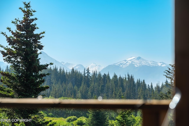 2500 W Highland Dr, Homer, AK 99603 - view of mountain backdrop featuring a heavily wooded area