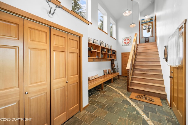 2500 W Highland Dr, Homer, AK 99603 - mudroom featuring a high ceiling and dark stone finish floors