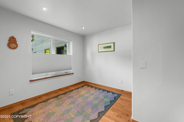 2500 W Highland Dr, Homer, AK 99603 - empty room with wood finished floors and recessed lighting
