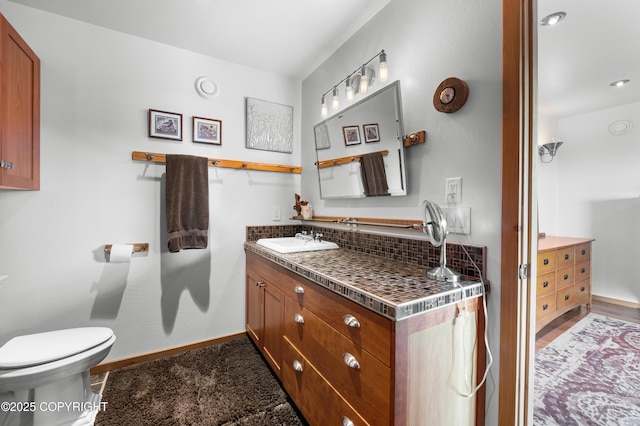 2500 W Highland Dr, Homer, AK 99603 - bathroom featuring vanity and backsplash