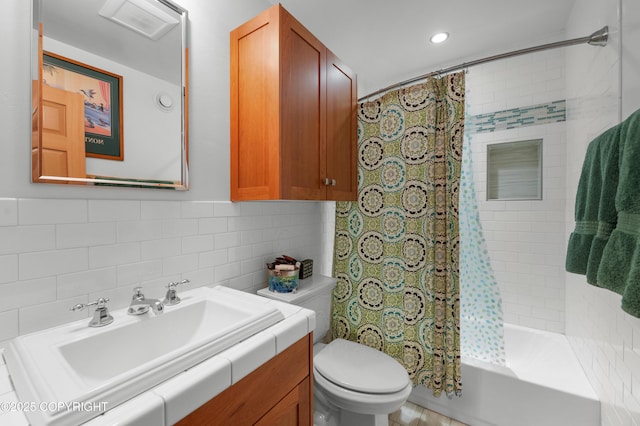 2500 W Highland Dr, Homer, AK 99603 - bathroom featuring vanity, shower / bathtub combination with curtain, backsplash, tile walls, and recessed lighting