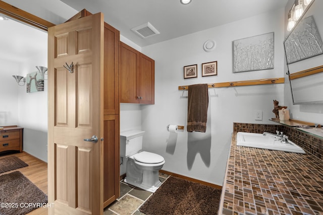 2500 W Highland Dr, Homer, AK 99603 - bathroom featuring tiled bath and backsplash