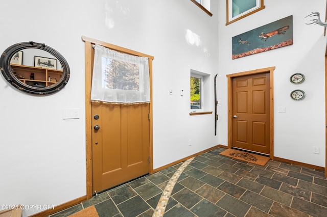 2500 W Highland Dr, Homer, AK 99603 - foyer entrance with a high ceiling and dark stone finish floors