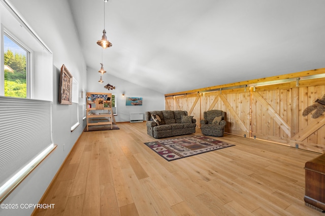 2500 W Highland Dr, Homer, AK 99603 - living area with vaulted ceiling, wood finished floors, and wood walls