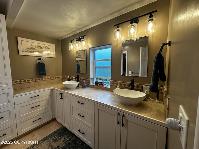 231 Main St, Seldovia, AK 99663 - bathroom featuring double vanity and tile patterned floors