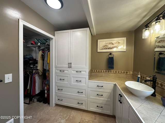 231 Main St, Seldovia, AK 99663 - bathroom with vanity and a walk in closet